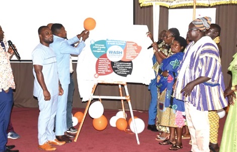 Imelda Agyeiwaa Kumah (4th from right), Assistant Director, Ashanti Regional Co-ordinating Council, being assisted by Nana Adu Akosua Fofie II (3rd from right), the Drobonsohemaa, to unveil the project. Those looking on include  Abubukar Issakab (2nd from left), DCE for Sekyere Afram Plains, and Sampson Bori (in smock), Isa Chief, Sekyere Afram Plains. Picture: EMMANUEL BAAH