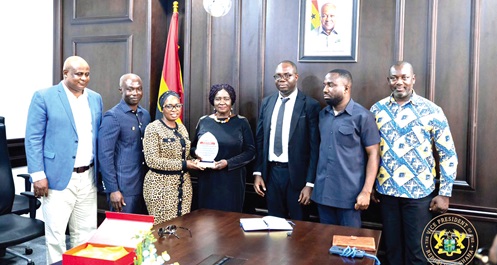 Professor Naana Jane Opoku-Agyemang (middle), Vice -President, receiving a plaque from the leadership of CPC  in recognition of her advocacy for value addition and for promoting the consumption of Ghanaian-processed cocoa products