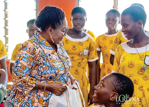 Lordina Mahama (left), interacting with some of the students 