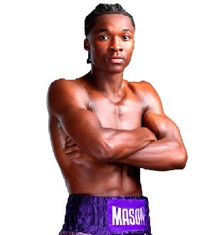 Abdullah Mason lands a hook to the body of Sam Noakes during the fight