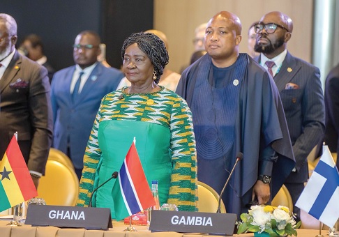 Prof. Naana Jane Opoku-Agyeman, Vice-President, observing a salute at the AU-EU Summit in Angola. With her is Samuel Okudzeto Ablakwa, Minister of Foreign Affairs