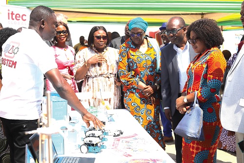 Judah  Oddoye (left), Municipal BSTEM Lead Facilitator, Mathematics, explaining a point to Lydia Essuah (right), Chief Director, MoE; Prof. Ernest Kofi Davis (2nd from right), DG, GES, and other dignitaries  Picture: EDNA SALVO KOTEY
