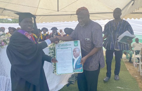 Prof. Mawutor Avoke (right), former Vice-Chancellor of the University of Education, Winneba, and currently Chairman of the Ghana Education Service Council, presenting the 2024 overall best graduating student award to Michael Asirifi