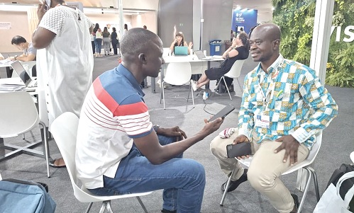 Timothy Ngnenbe (left), a journalist with the Daily Graphic, interviewing Dr Antwi-Boasiako Amoah, Director of Climate Vulnerability at the EPA, during COP30 at Belem, Brazil