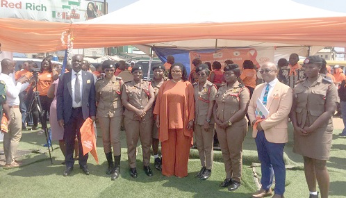Dr Agnes Naa Momo Lartey (4th from left), Minister of Gender, Children and Social Protection; Zia Choudhury (2nd from right), UN Resident Coordinator, and Dr Wilfred Ochan (left), UNFPA Country Representative, with some fire service officials at the launch