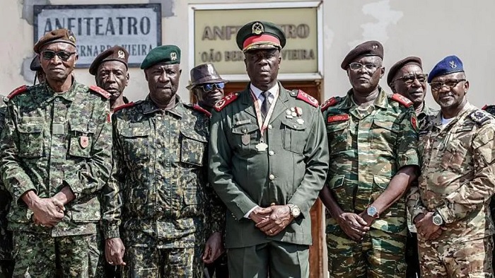 Gen Horta N'Tam, centre, becomes the transitional head of state for one year