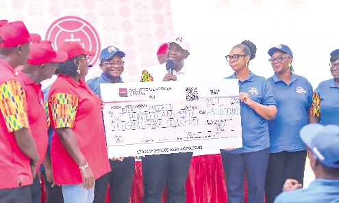 Sir Kt Bro Constantine K. M. Kudzedzi (with microphone), the Supreme Knight, thanking members of the Greater Accra Regional Councils and Courts after receiving a dummy cheque for GH¢250,000  to support the construction of a Legacy Project