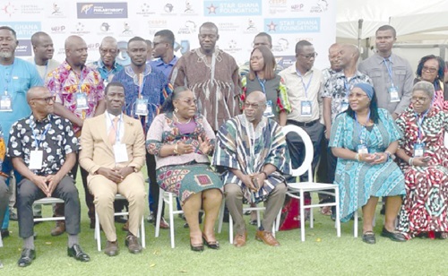 Nana Oye Bampoe Addo (seated 3rd from left), Deputy Chief of Staff in charge of Administration, explaining a point to Ibrahim-Tanko Amidu (seated 3rd from right), Executive Director of STAR Ghana Foundation, after the Ghana Philanthropy Conference 2025. Those with them are some participants