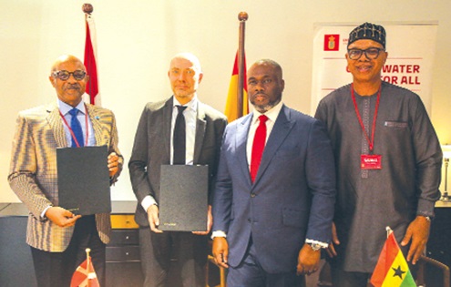 Osama Makkawi Khogali (left), UNICEF Representative in Ghana, with Jakob Linulf (2nd from left), Ambassador of Denmark to Ghana; Kenneth Gilbert Adjei (2nd from right),  Minister of Works, Housing and Water Resources, and Adam Mutawakilu (right), Managing Director, GWL, after signing of the partnership. Picture: CALEB VANDERPUYE