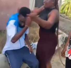 Woman seen in video assaulting man arrested by police