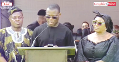 Fifi Fiavi Kwetey, General Secretary of the NDC, reading the party's tribute