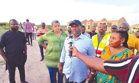 Kenneth Gilbert Adjei (arrowed), Minister of Works, Housing and Water Resources, briefing the media at Kpotame in the South Tongu Municipality.