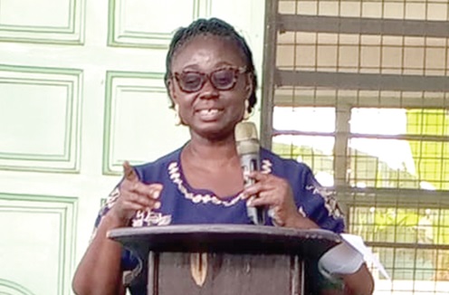 Janet Sarney-Kuma (inset) delivering a remark to the students