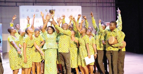 The Comboni Technical Institute choir jubilating with the trophy after they were declared winners