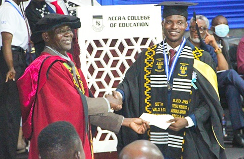 Gabriel Nii Noi Dowuona (left), Council Chair, Accra College of Education, presenting the Overall Best Student award to Seth Sarpong Abassah.  Picture: ERNEST KODZI 