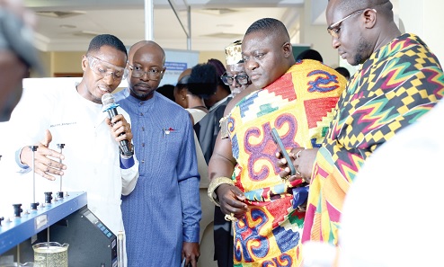 Joseph Awinbisah Akoligu (left, with mic), Assistant Officer, Water Quality Assurance, Ghana Water Limited, briefing Nana Amponsah Kwaa (2nd from right) and his entourage. Picture: BENEDICT OBUOBI