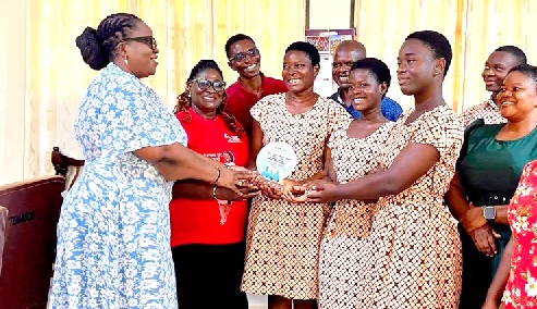 Harriet Adelaide Tagoe (left), Managing Director of Afram Publications Ltd, presenting the award to the winners