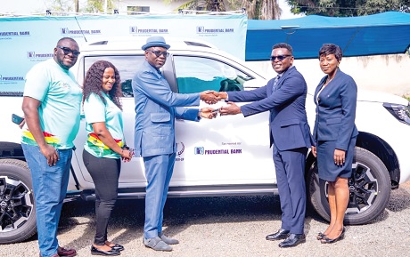 Edward Commey (2nd from right), Executive Head, Corporate and Institutional Banking at PBL, presenting the keys to the car to Dr Christian Addai-Poku, Registrar of NTC. looking on are Akosua Boahen (right), Head of Corporate Affairs at PBL,  Grace Duah (2nd from left) and Dennis Osei Owusu, both of NTC