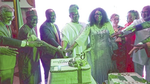 Ifedayo Moses Adeoyo (4th from left), Nigerian High Commissioner to Ghana, being assisted by Emmanuel Armah-Kofi Buah (3rd from left), Minister of Lands and Natural Resources, and other dignitaries to cut Nigeria’s 65th Independence Anniversary cake Ifedayo Moses Adeoyo (4th from left), Nigerian High Commissioner to Ghana, being assisted by Emmanuel Armah-Kofi Buah (3rd from left), Minister of Lands and Natural Resources, and other dignitaries to cut Nigeria’s 65th Independence Anniversary cake
