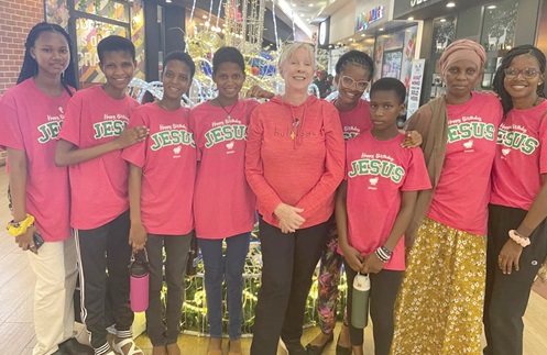 Mama Beth (middle) with some of her adopted daughters after a lunch out on a Christmas eve