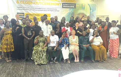 Speakers (seated)  with some beneficiaries at the closing ceremony