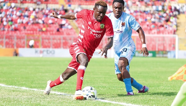 •Kotoko’s Lord Amoah dribbling past Kojo Kuma of Heart of Lions during yesterday’s game •Kotoko’s Lord Amoah dribbling past Kojo Kuma of Heart of Lions during yesterday’s game
