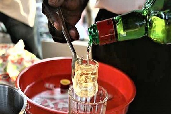 Dr Dwomoa Adu (with the mic), Senior Research Fellow at the Korle Bu Teaching Hospital, speaking at the lecture while Vincent Boima (right), a Professor of Medicine and Nephrology at the University of Ghana Medical School, awaits his turn