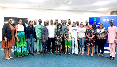 Reporters and some officials of IOM after the media briefing