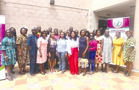 Bernice Sam (6th from left), a Gender Consultant, with Cynthia Sunu (7th from right), Programme Manager, NETRIGHT, and Lydia Dogee (6th from right) and some members of the CSOs after the training