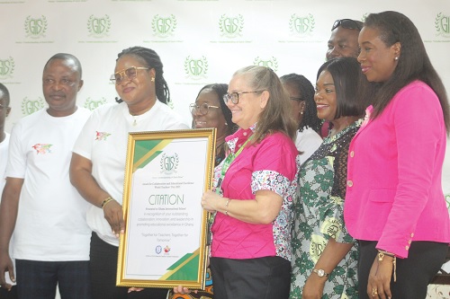 Gifty Abena Turkson (2nd from left), Deputy General Secretary of the Teachers and Educational Workers Union, presenting a citation to Angela Vanderpuije (3rd from right), Vice Principal of the Lower Secondary School at Ghana International School, to commemorate 2025 World Teachers' Day. Picture: ESTHER ADJORKOR ADJEI 