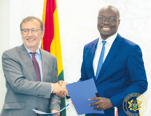 Dr Cassiel Ato Forson (right) and Angel Lossada Torres-Quevedo, Spanish Ambassador to Ghana, exchanging the signed documents