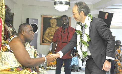 Dr Christian Rogg paying homage to Nii Ayi-Bonte at his palace in Accra