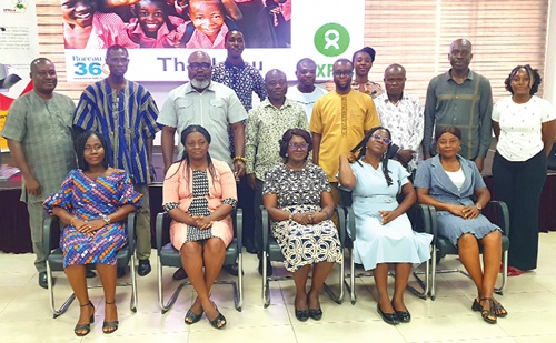 Kofi Asare (standing 3rd from left), Executive Director, Africa Education Watch, with Dorothy Konadu (seated middle), Reginald George Quartey (2nd from right), Director, NaCCA, some dignitaries and other participants. Picture: ERNEST KODZI 