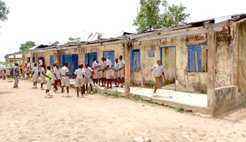 The roof of a section of the classroom block ripped off by heavy storms but unattended to