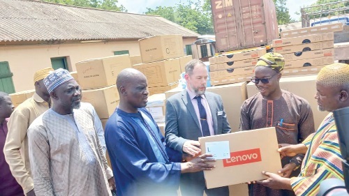Haruna Iddrisu (2nd from left), Minister of Education, handing over the items to Alhassan Alidu Jnr (2nd from right), Northern Regional Director of Education, for onward distribution