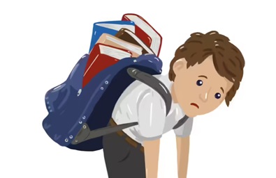 A child with a heavy school bag A child with a heavy school bag