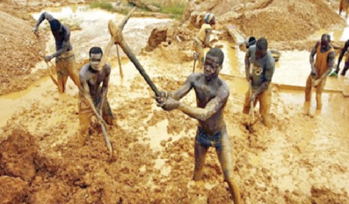 Illegal miners working at the site