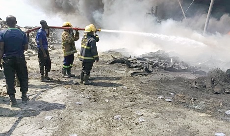 Firefighters from the GNFS attending to the blaze