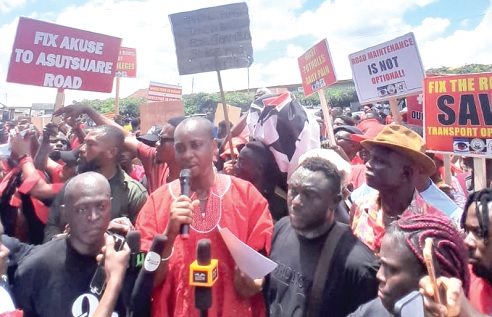 Isaac Tamatey (arrowed), Chairman of Kloma Hengme, reading the petitionIsaac Tamatey (arrowed), Chairman of Kloma Hengme, reading the petition