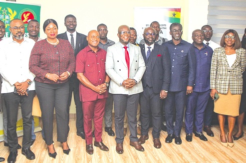 Prof. Michael Kpessa-Whyte (middle), Director-General of SIGA, with Eric Bonsu Agyabeng (left), acting Head of the Performance Monitoring and Evaluation Division, and other officials after the event. Picture: CALEB VANDERPUYE