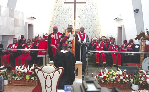 Most Rev. Professor Johnson Kwabena Asamoah-Gyadu, Presiding Bishop of the Methodist Church Ghana, laying hands on Rt Rev. Ebenezer Popeson Adjei, newly elected Bishop of the Tema Diocese of the Methodist Church Ghana, during the induction service  