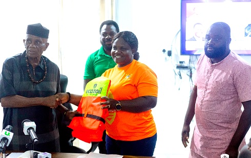 Yaa Oforiwaa (2nd from right), National Coordinator, Volta Lake Transport Safety Project, presenting the vests to John Kwadwo Gyapong, Oti Regional Minister Yaa Oforiwaa (2nd from right), National Coordinator, Volta Lake Transport Safety Project, presenting the vests to John Kwadwo Gyapong, Oti Regional Minister