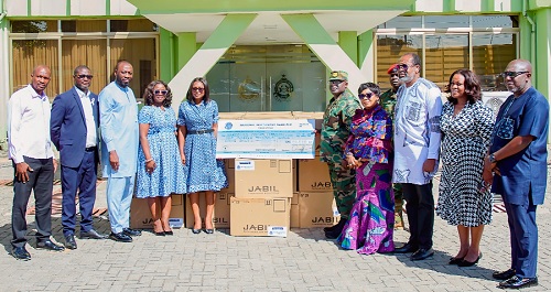 Ernestina Kutin (5th from left), the Chief Human Resource Officer, NIB, presenting the dummy cheque and computers to Brigadier General Maxwell Obuba Mantey, the Director General, NACOC. With them are officials of the NIB and NACOC. Picture: NACOC Ernestina Kutin (5th from left), the Chief Human Resource Officer, NIB, presenting the dummy cheque and computers to Brigadier General Maxwell Obuba Mantey, the Director General, NACOC. With them are officials of the NIB and NACOC. Picture: NACOC