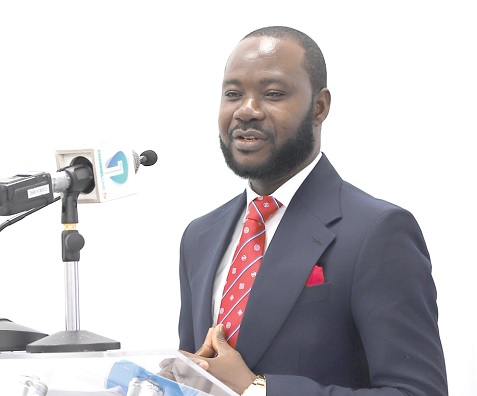 Dr Adu Owusu Sarkodie (right), Executive Director of the Centre for Policy Scrutiny, speaking at the event