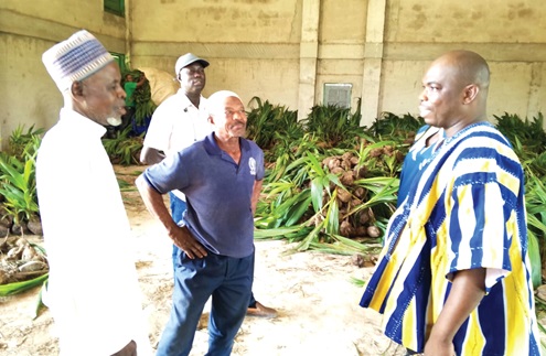 Wilfred Zuuri (right), Kintampo South District Chief Executive, interacting with some of the farmers  Wilfred Zuuri (right), Kintampo South District Chief Executive, interacting with some of the farmers
