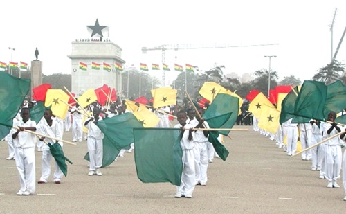Ghanaian youth demonstrating the spirit of patriotism with the national flag Ghanaian youth demonstrating the spirit of patriotism with the national flag