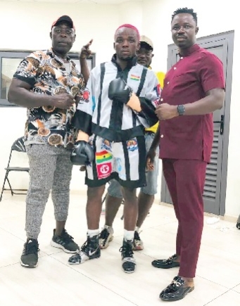 George Faho Mensah (middle) with his coach Emmanuel Annor Yeboah and  Samuel Samuel Agyei Darkwah (right), manager of the boxer George Faho Mensah (middle) with his coach Emmanuel Annor Yeboah and  Samuel Samuel Agyei Darkwah (right), manager of the boxer
