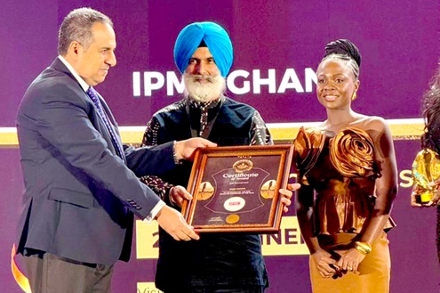 Amar Deep Singh Hari (middle), receiving a certificate of award