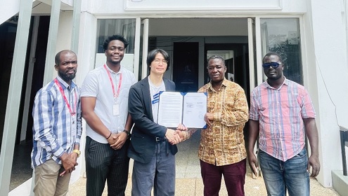 Kim Minhong (middle), Managing Director of Datamaker Ghana Limited, and Professor Ebenezer Owusu (2nd from right), Head of the Department of Computer Science, UG, displaying the document of the MoU after the signing Kim Minhong (middle), Managing Director of Datamaker Ghana Limited, and Professor Ebenezer Owusu (2nd from right), Head of the Department of Computer Science, UG, displaying the document of the MoU after the signing