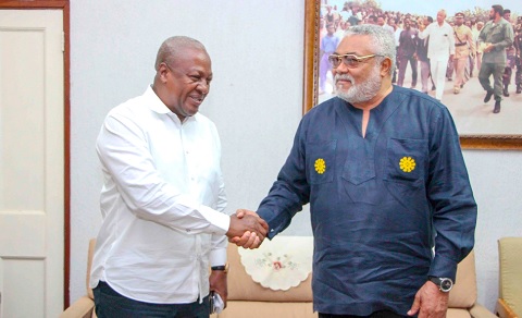 President John Mahama (left) in a handshake with late President Jerry John Rawlings during an event